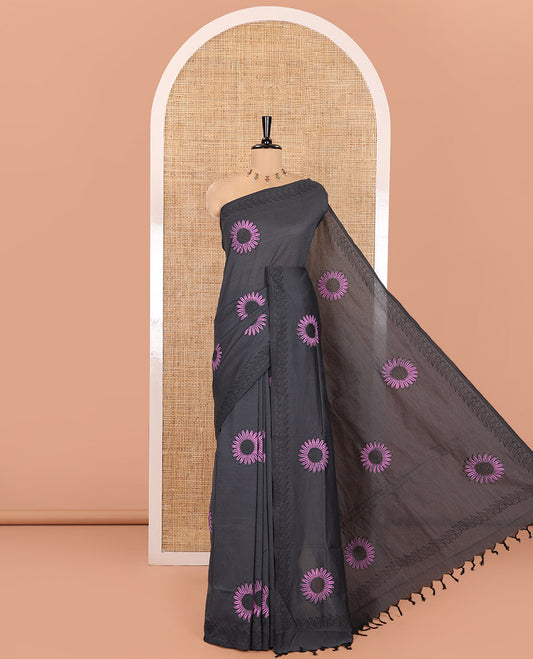 Grey South Cotton Saree, Decked Up with Handblock Printed Sunflower Motifs All Over Its Body, Subtly Block Printed Border, Paired with a Matching Blouse, and a Contrast Floral Block Printed Blouse