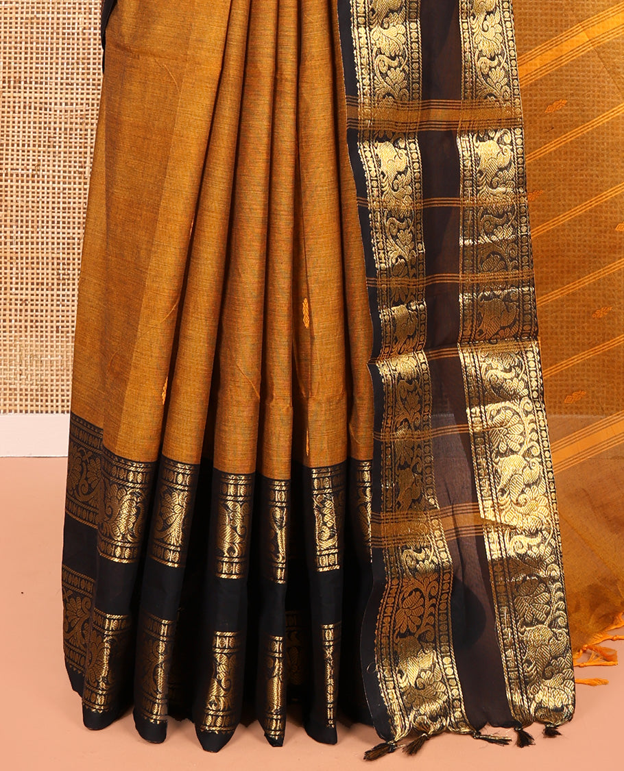 Mustard Chettinad Cotton Saree, Sparsely Woven with Buttas on Its Body, Complemented by a Contrast Rettai Pettu Border of Temple, Peacock, and Floral Creeper Designs, Pallu of Stripes and Buttas, and Paired with a Matching Blouse