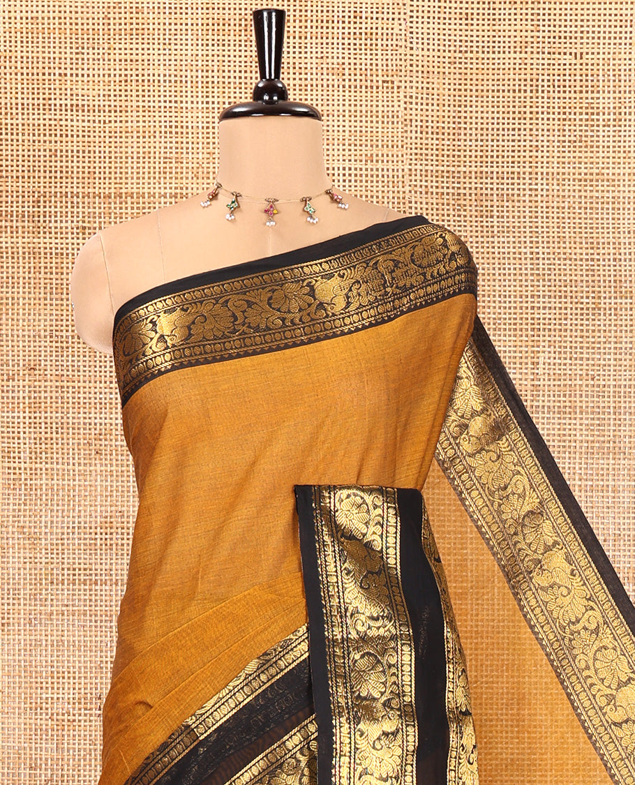 Mustard Chettinad Cotton Saree, Sparsely Woven with Buttas on Its Body, Complemented by a Contrast Rettai Pettu Border of Temple, Peacock, and Floral Creeper Designs, Pallu of Stripes and Buttas, and Paired with a Matching Blouse
