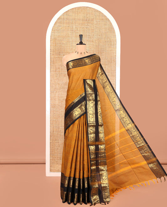 Mustard Chettinad Cotton Saree, Sparsely Woven with Buttas on Its Body, Complemented by a Contrast Rettai Pettu Border of Temple, Peacock, and Floral Creeper Designs, Pallu of Stripes and Buttas, and Paired with a Matching Blouse