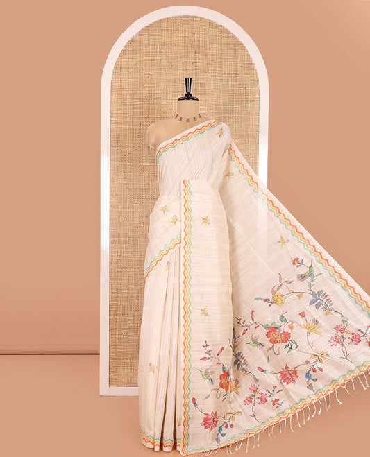 Chikku Semi-Tussar Silk Saree, Beautified with Floral Motifs Printed on Its Body, a Subtle Chevron Striped Border, Pallu Highlighted by Colorful Floral Vine Print, and Paired with a Matching Printed Blouse