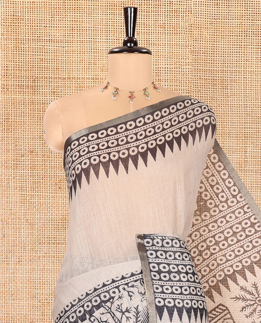 Chikku Plain Linen Cotton Saree, Artfully Printed Pallu of Temple Motifs, Circles, and Warli Village Themed Motifs Printed All Over Its Body, and Border, Pallu Pictures Warli Village Theme Motifs, and Paired with a Contrast Blouse