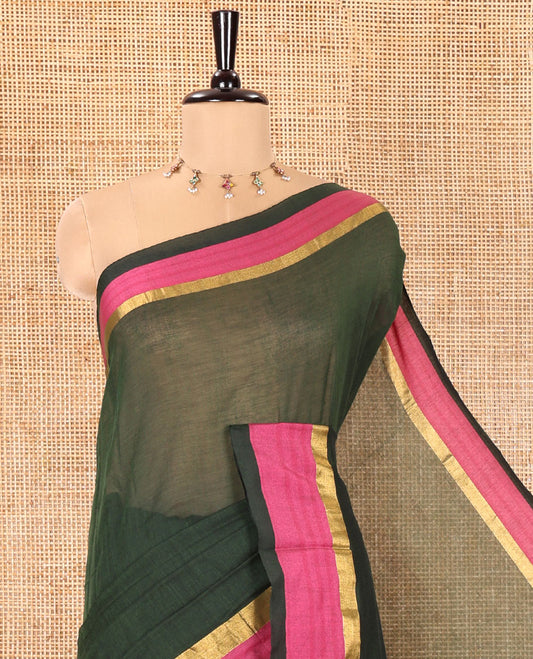 Green Plain Khadi Mul Cotton Saree, Complemented by a Contrast Pink Zari Border, Plain Pallu, and Paired with a Matching Blouse