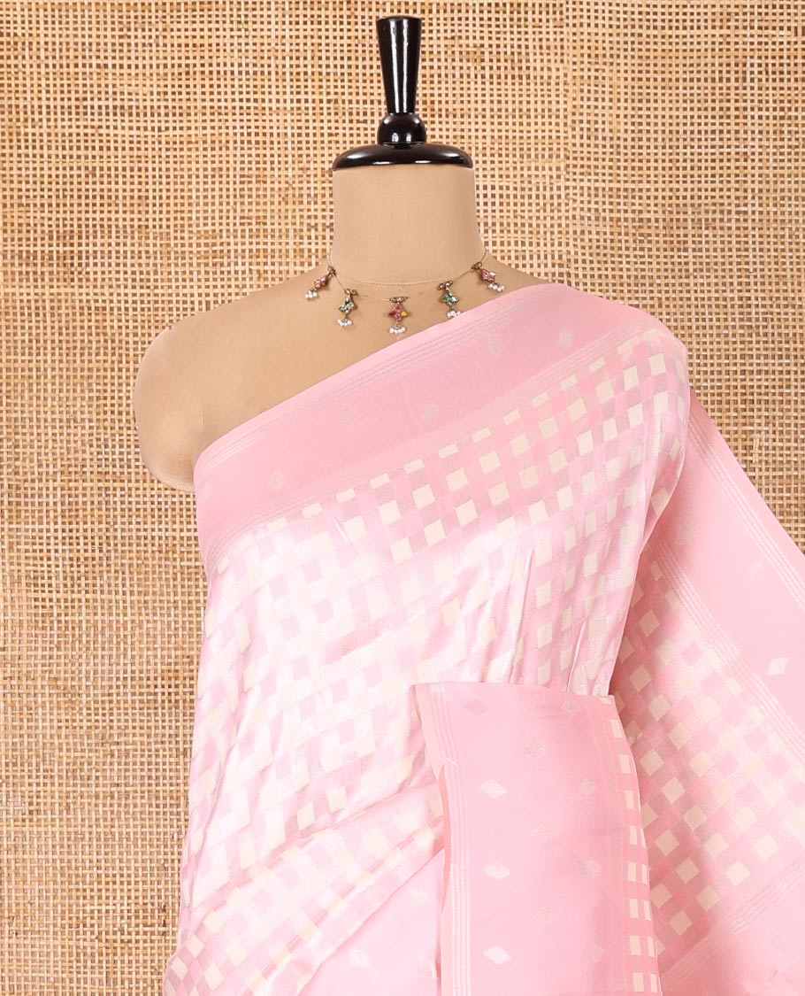 Pink Kanchi Silk Saree, Embellished with Checked Design on Its Body, Highlighted by a Self-Border of Diamond Patterns, Pallu Steeped with Buttas, and Paired with a Matching Blouse