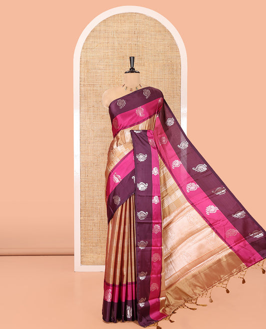 Gold Warm Silk Saree, Majestically Detailed with Zari Buttas and Zari Checks on Its Body, Complemented by a Contrast Temple Border of Unique Designs, Intricately Designed Pallu, and Paired with a Matching Blouse