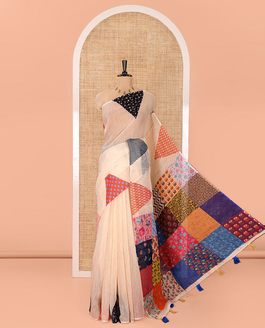 Cream Plain Linen Cotton Saree, Complemented by a Contrast-Colored Triangle on Its Border, Kaleidoscopic-Color Patchwork Pallu, and Paired with a Contrast Blouse