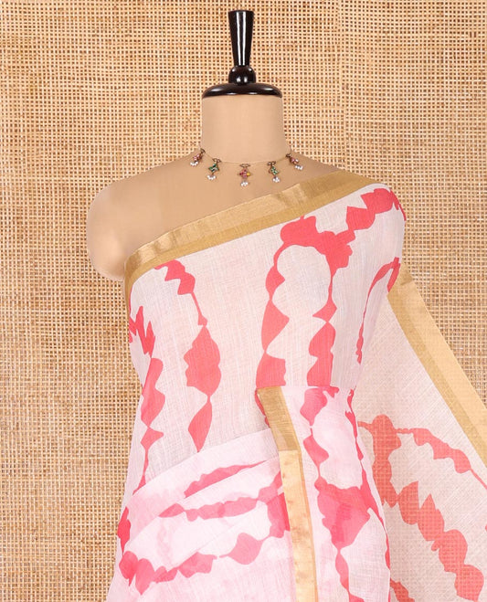 White Linen Cotton Saree, Adorned with Shibori Print On Its Body, Subtle Piping Border, Pallu Steeped with Floral Vine Print, and Paired with a Printed Blouse