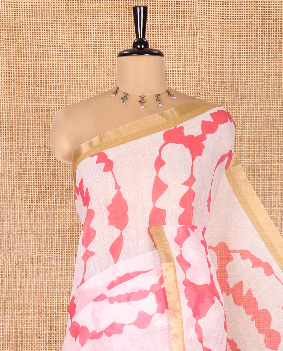 White Linen Cotton Saree, Adorned with Shibori Print On Its Body, Subtle Piping Border, Pallu Steeped with Floral Vine Print, and Paired with a Printed Blouse