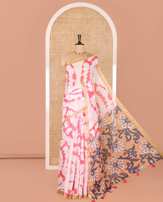 White Linen Cotton Saree, Adorned with Shibori Print On Its Body, Subtle Piping Border, Pallu Steeped with Floral Vine Print, and Paired with a Printed Blouse