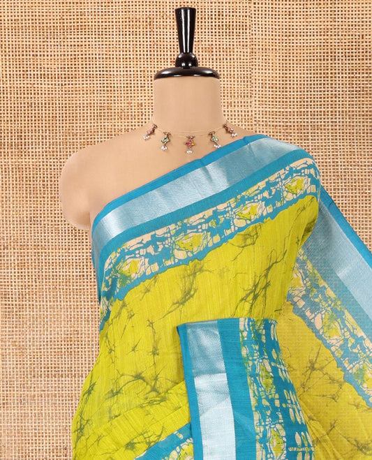 Lemen Yellow Linen Cotton Saree, Adorned with Shibori Printed All Over Its Body, Complemented by a Contrast Batik Printed Zari Border, Floral Printed Pallu, and Paired with a Contrast Blouse
