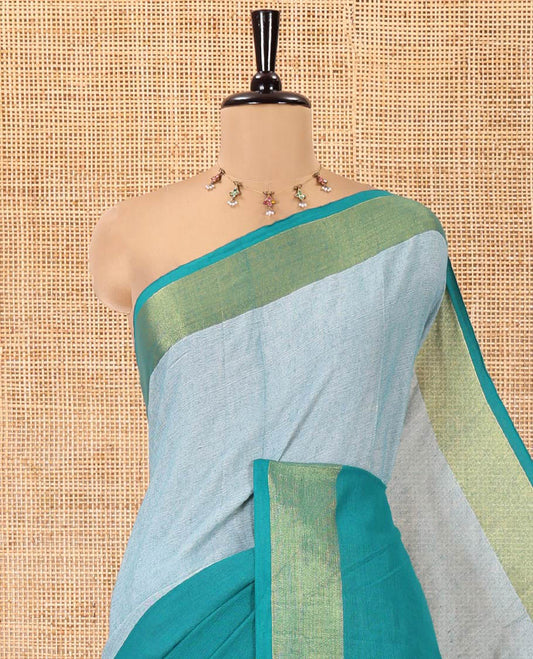 Peacock Green Khadi Mul Cotton Saree, Adorned with Half-And-Half-Style Double-Colour Dyed on Its Body, a Subtle Zari Border, Striped Pallu, and Paired with a Matching Blouse
