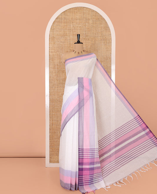 White and Lavender Chettinad Cotton Saree, Subtly Sparkled with Stripes All Over Its Body, Complemented by a Contrast Tri-Colored Striped Border, Pallu of Stripes, and Has No Blouse