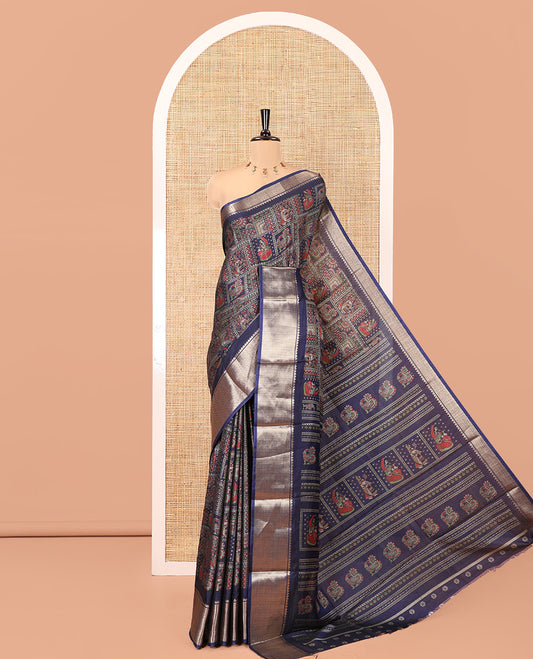 Navy Blue Dola Silk Saree Features Kalamkari Peacock-Human Print, a Traditional Zari Border, Printed Pallu, and a Matching Blouse