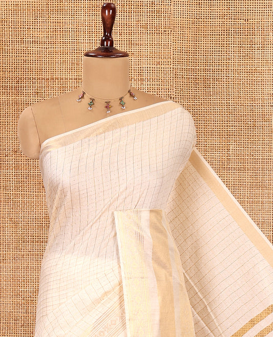 Cream Bhagalpuri Cotton Saree, Adorned with Butta Enclosed Checks, a Traditional Zari Border, and a Matching Blouse