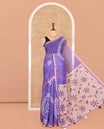 Violet Linen Cotton Saree Features Warli Print, a Contrast Piping Border, a Floral-Printed Pallu, and a Contrast Blouse