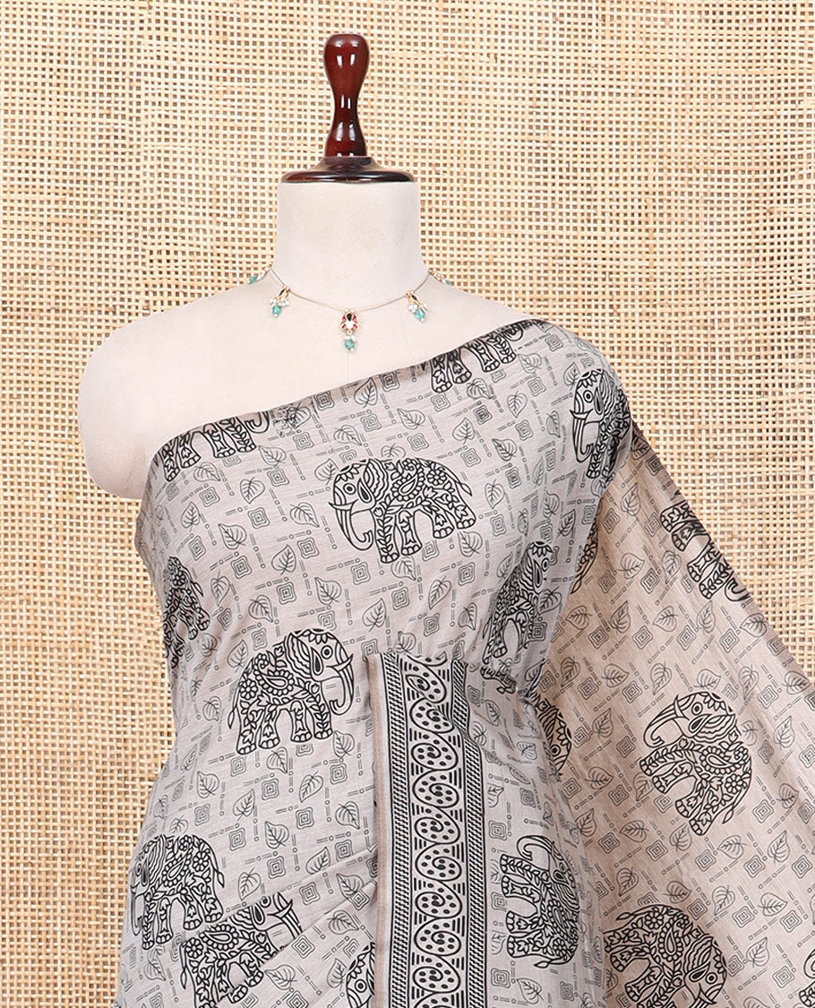 Light Brown South Cotton Saree Features Leaf and Elephant Motifs Print, a Subtle Printed Border, and a Matching Blouse