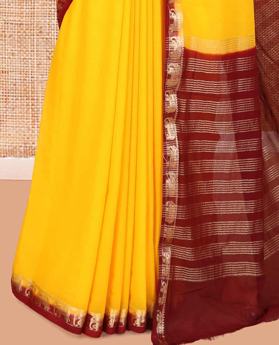 Yellow Plain Fancy Chiffon Saree, a Contrast Elephant Zari Border, Zari Striped Pallu, and a Contrast Blouse