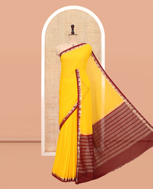 Yellow Plain Fancy Chiffon Saree, a Contrast Elephant Zari Border, Zari Striped Pallu, and a Contrast Blouse