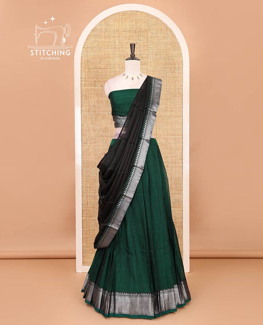 Bottle green Mercerised cotton half-saree, plain & contrast mayil kann temple border skirt, matching blouse & contrast zari border syska georgette dhavani