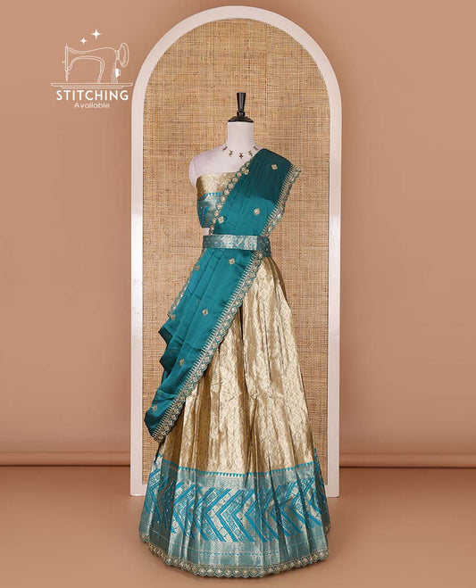 Gold banaras half saree, ogee skirt, contrast rama blue traditional zari border, matching blouse, and Syska georgette embroidered dhavani