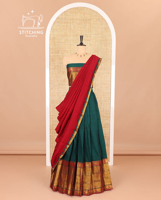 Dark green half-saree, plain with big contrast traditional zari motifs steeped border skirt, matching blouse and a plain zari border contrast dhavani