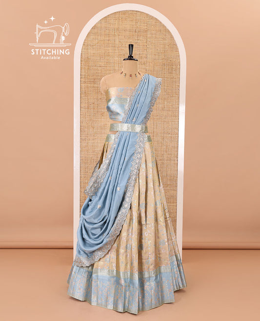 Fawn banarasi half-saree, floral jaal thread weave with contrast floral thread bordered skirt, a matching blouse, and scallop embroidered dhavani with belt
