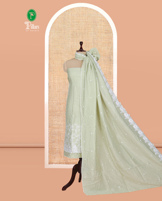 Pista Green Mul Chanderi Material Churidar with Delicate Floral Embroidered Top, a Plain Bottom, and Scallop Embroidered Dupatta