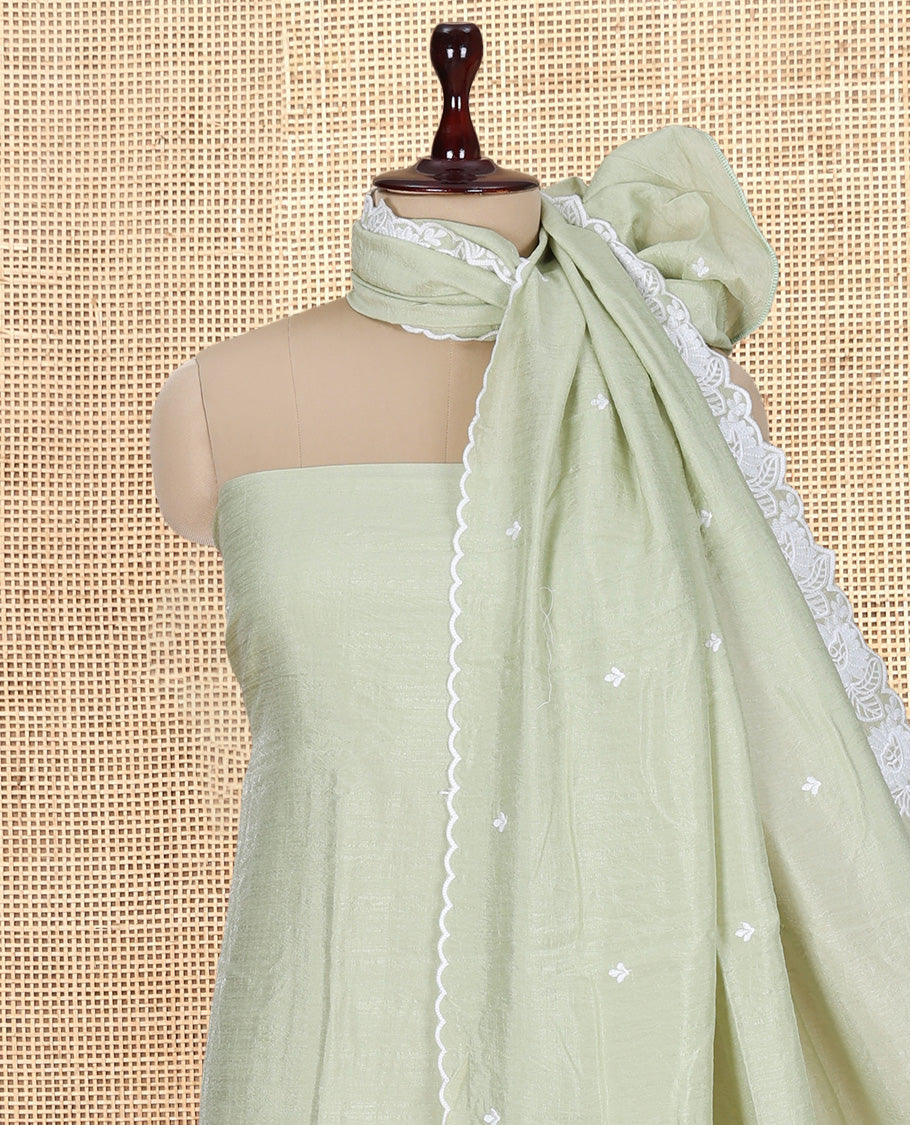 Pista Green Mul Chanderi Material Churidar with Delicate Floral Embroidered Top, a Plain Bottom, and Scallop Embroidered Dupatta