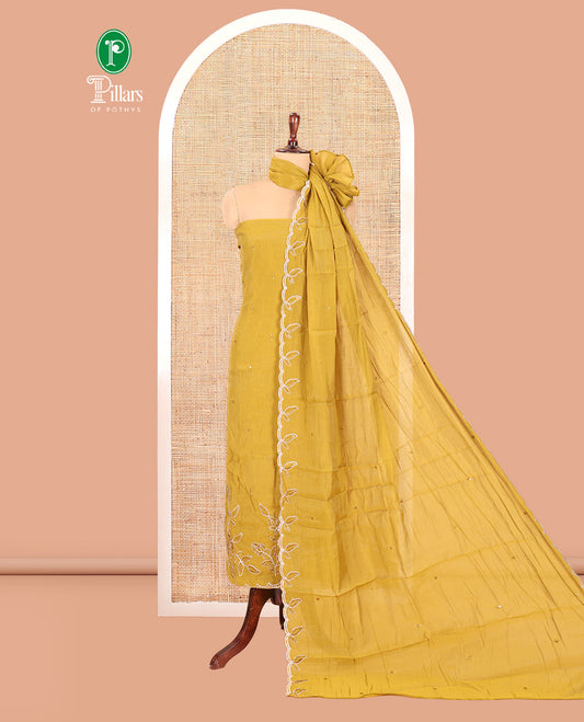 Mehendi Green Mul Chanderi Material Churidar Features a Floral Outline Embroidered Top, a Santoon Bottom, a Scallop Threadwork Dupatta