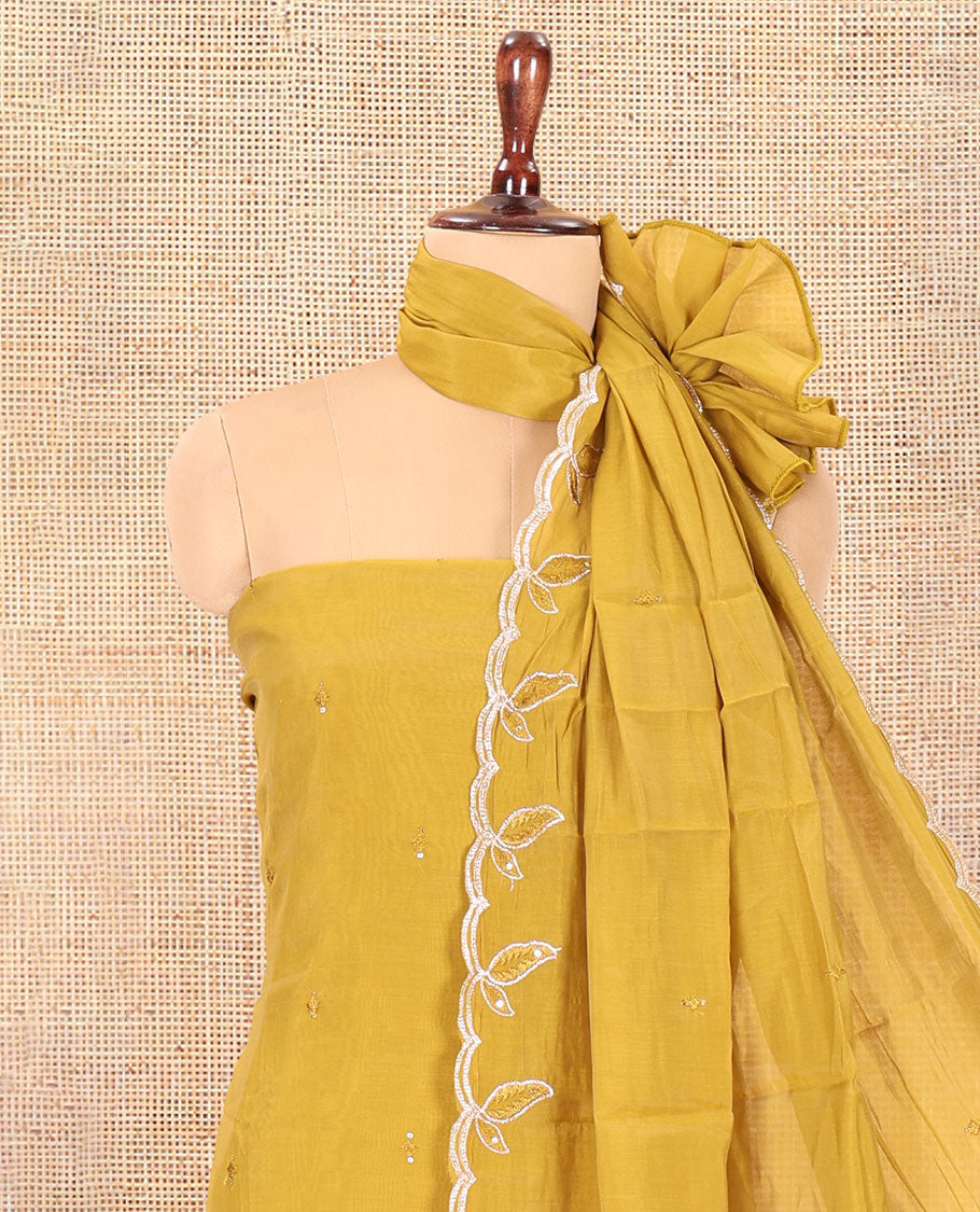 Mehendi Green Mul Chanderi Material Churidar Features a Floral Outline Embroidered Top, a Santoon Bottom, a Scallop Threadwork Dupatta