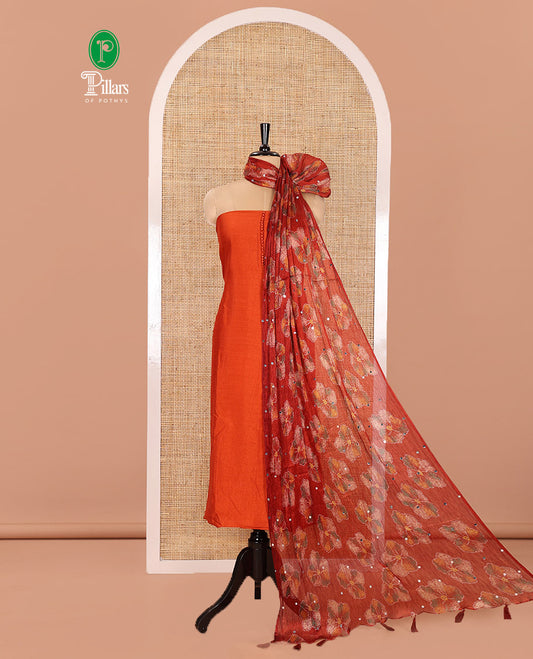 Orange Material Churidar Set, Bedecked up with Plain Vichitra Silk Top, Comes with a Plain Santoon Bottom, and Is Paired with a Crushed Chiffon Dupatta of Floral Print and Mirror Work