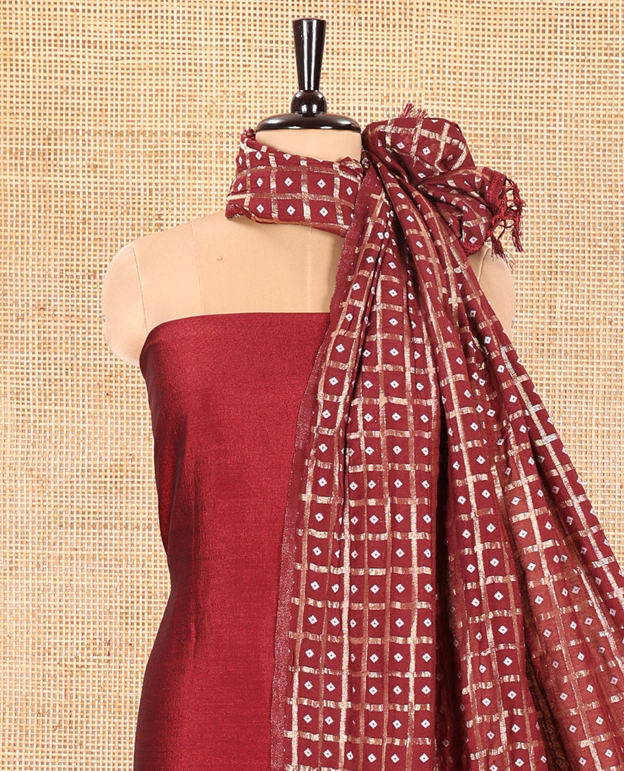 Maroon Vichitra Silk Material Churidar Set, Subtly Made Plain Top, a Plain Santoon Bottom, and Paired with a Vichitra Silk Bandhani Dot Enclosed Checked Dupatta