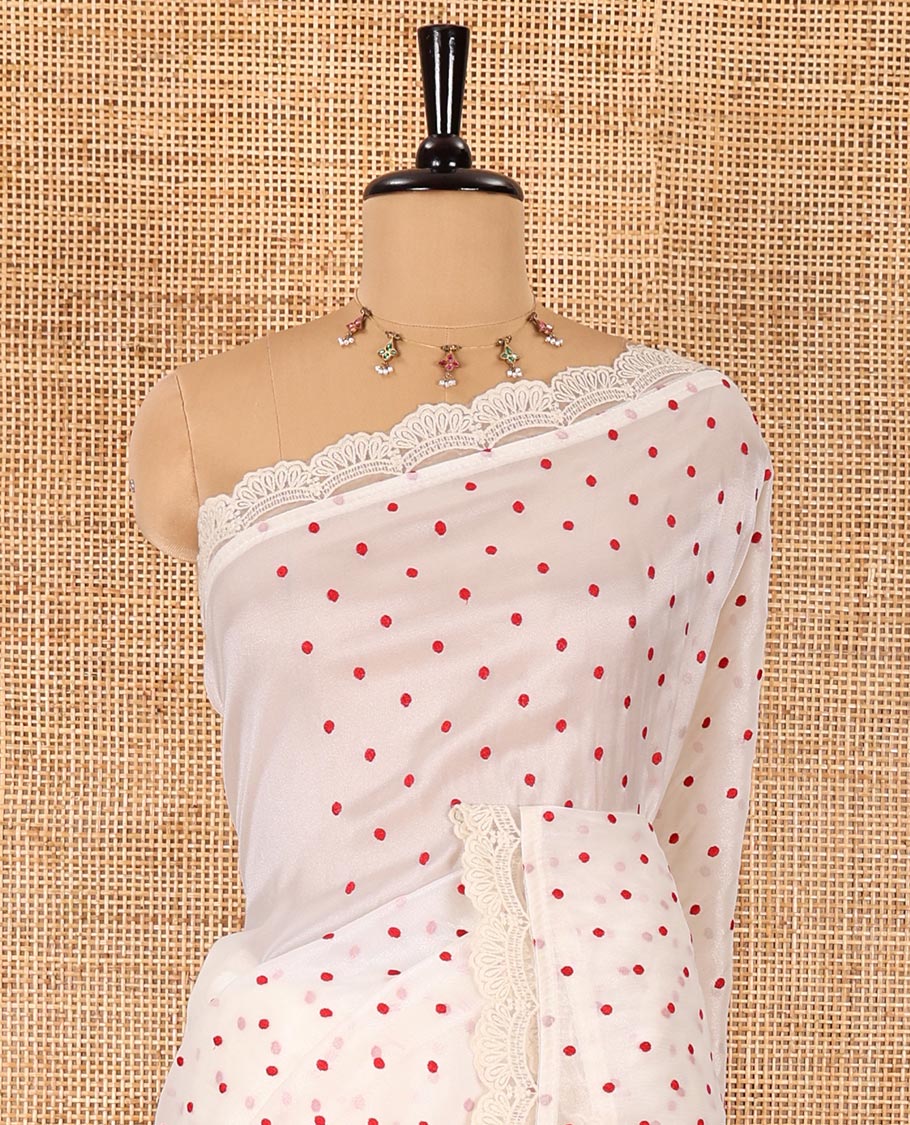 Off-White polka dots embroidered organza silk saree, scallop lace work border, and a matching lace bordered blouse