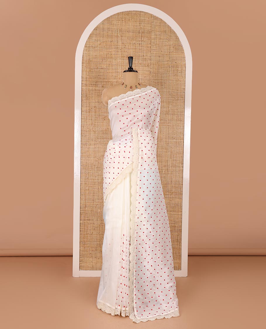 Off-White polka dots embroidered organza silk saree, scallop lace work border, and a matching lace bordered blouse