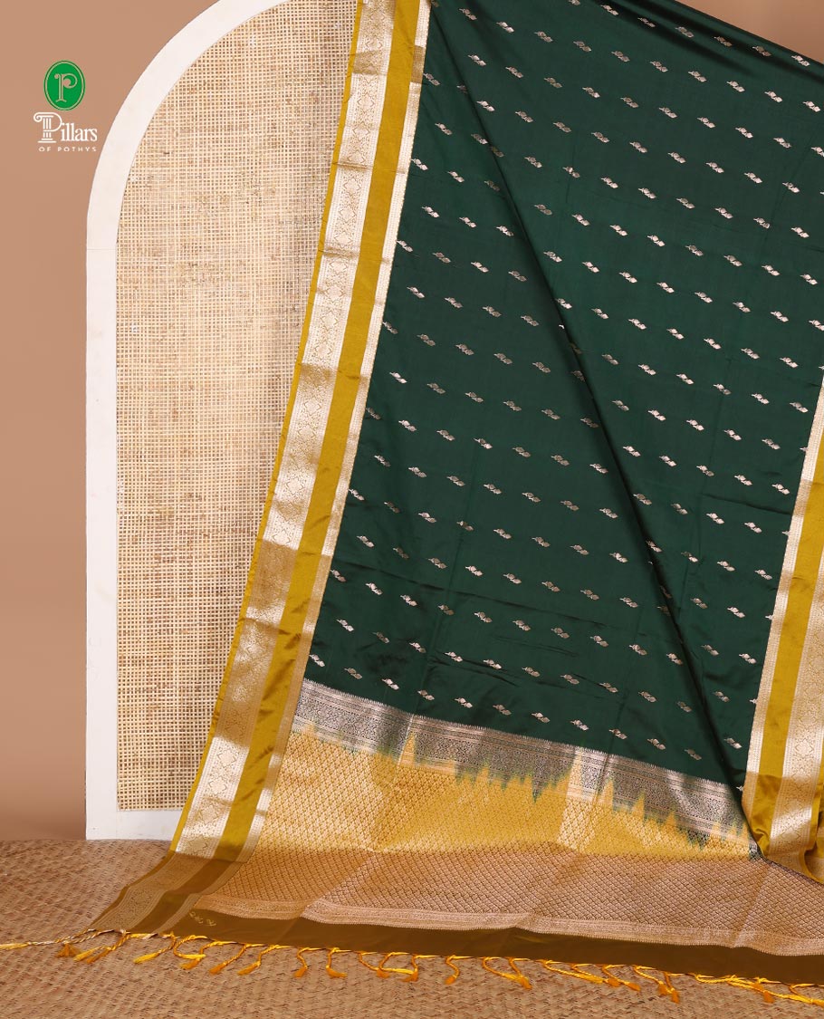 Bottle green zari butta semi soft silk saree with rettai pettu, diamond border grand pallu along with plain blouse