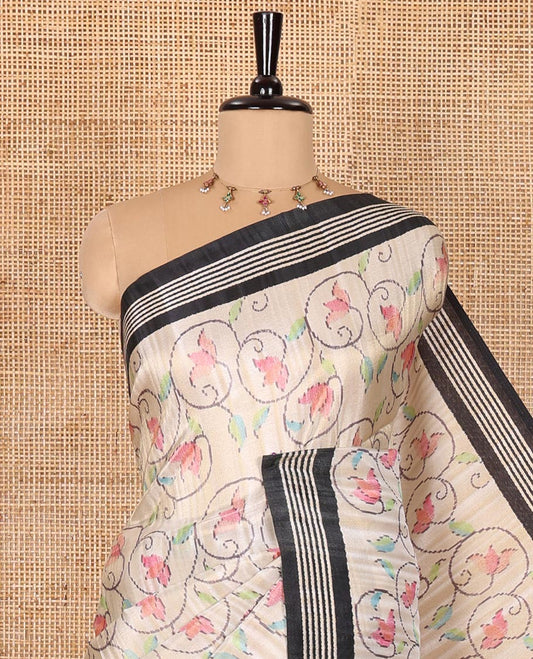 Chikku-black floral vine printed tissue patola saree, contrast striped border, pallu of floral and Pichwai cow motifs print, and a plain blouse