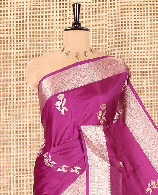 Purple Semi-Banaras Satin Silk Saree, Mesmerized with Floral Zari Buttas Across Its Body, Highlighted by Traditional Zari Design Border, Grand Zari Woven Palu of Jaal Designs, and Paired with a Matching Blouse