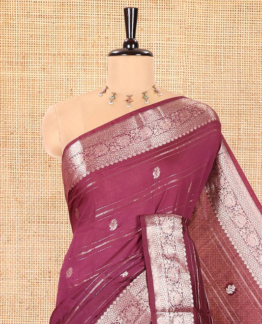 Wine Assam Silk Saree, Enthralled with Horizontal Zari Stripes and Zari Buttas All Over Its Body, Highlighted by a Traditional Zari Border of Floral Creeper Designs, Zari-Striped Pallu, and Paired with a Matching Blouse