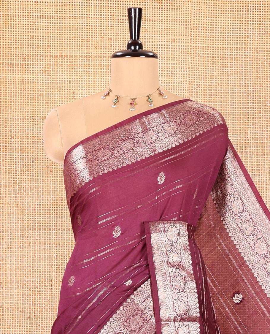 Wine Assam Silk Saree, Enthralled with Horizontal Zari Stripes and Zari Buttas All Over Its Body, Highlighted by a Traditional Zari Border of Floral Creeper Designs, Zari-Striped Pallu, and Paired with a Matching Blouse