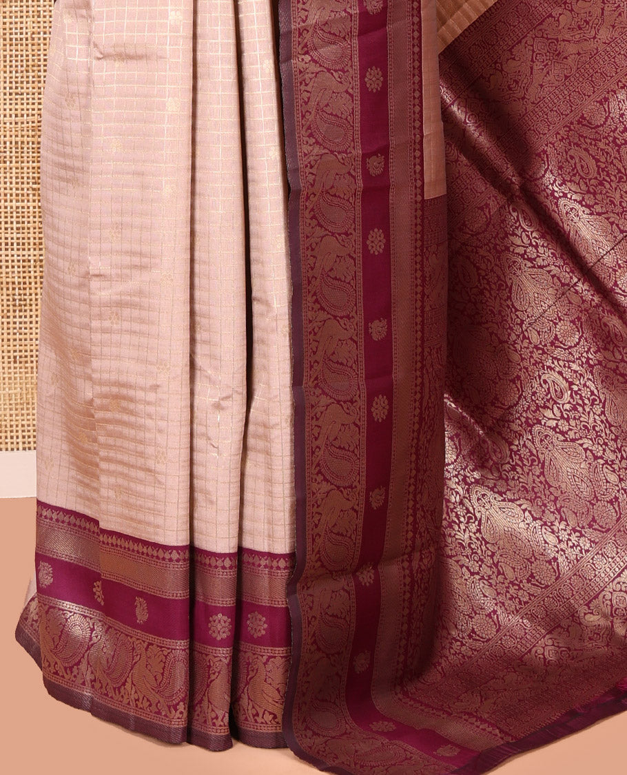 Beige Litchi Saree Features Buttas and Checks, Contrast Traditional Peacock Border, Intricate Pallu, and a Contrast Blouse