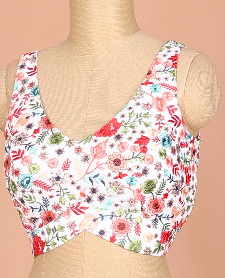White floral motifs thread embroidered sleeveless readymade blouse with front and back deep-leaf neck