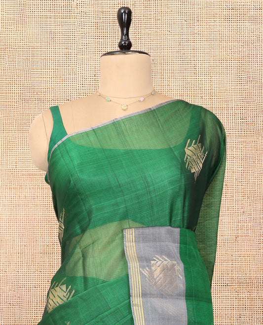 Green Cotton Saree, Enhanced with a Zari Buttas, Complemented by One-Side Zari Motif Border, a Contrast Chevron Pallu, and a Contrast Blouse