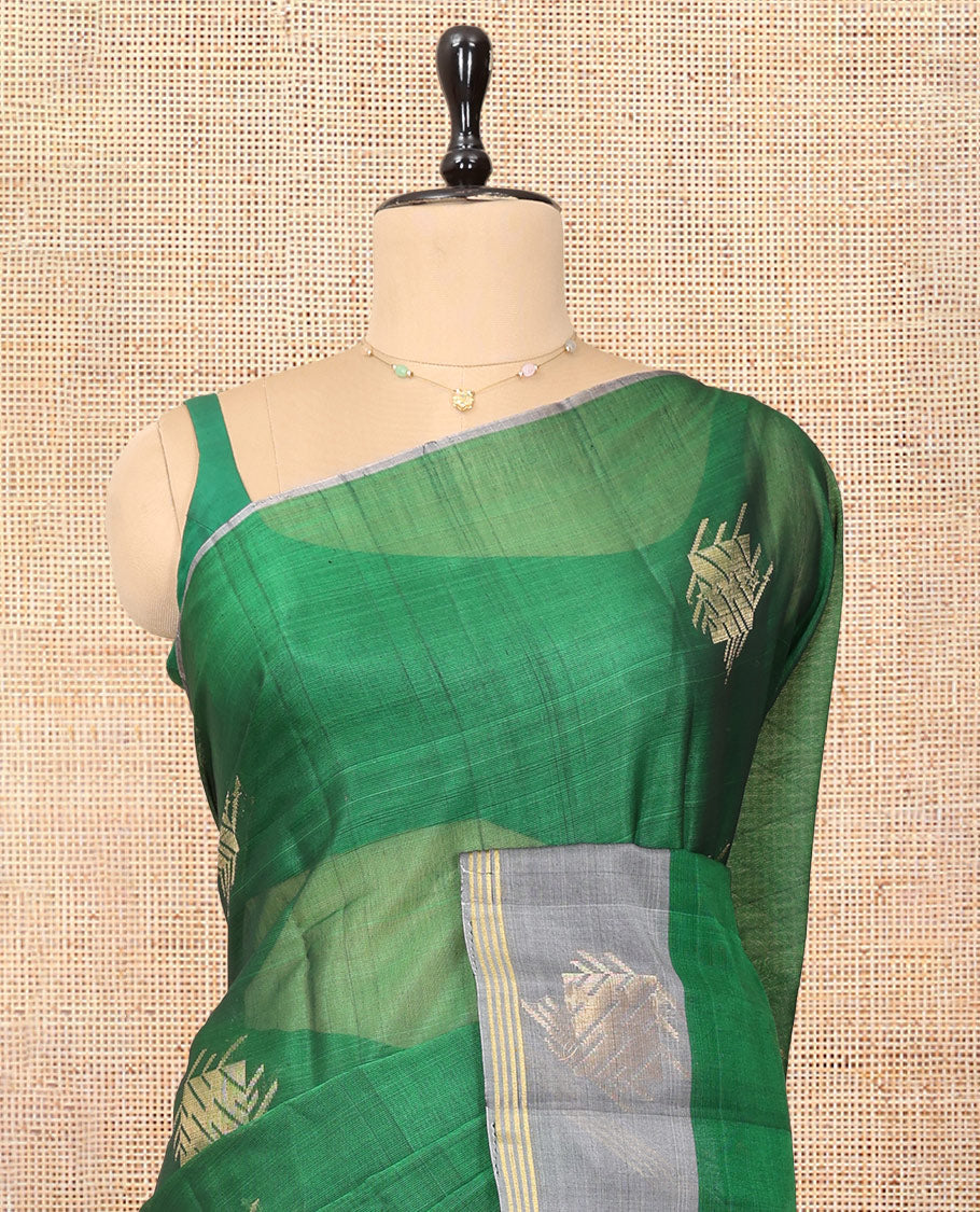Green Cotton Saree, Enhanced with a Zari Buttas, Complemented by One-Side Zari Motif Border, a Contrast Chevron Pallu, and a Contrast Blouse