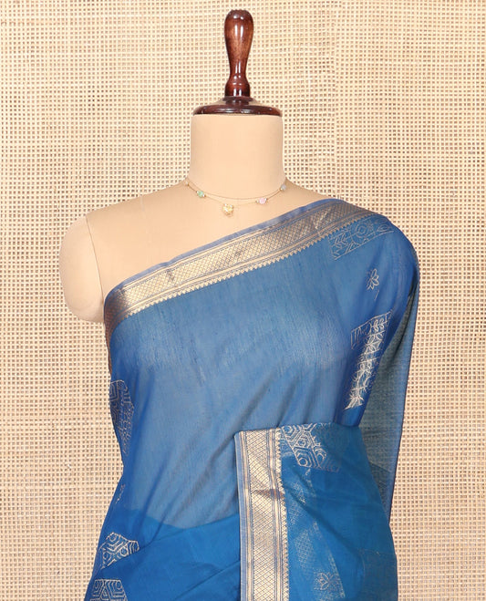 Blue Silk Cotton Saree, Accentuated with Geometric Buttas All Over Its Body, Highlighted by Traditional Zari Designs Woven Border, Intricately Designed Pallu and Paired with a Matching Blouse