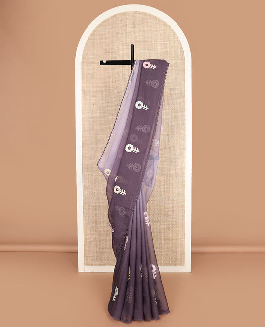 Grey ombre colored floral motifs saree, lace pom-pom border, and floral motifs pallu