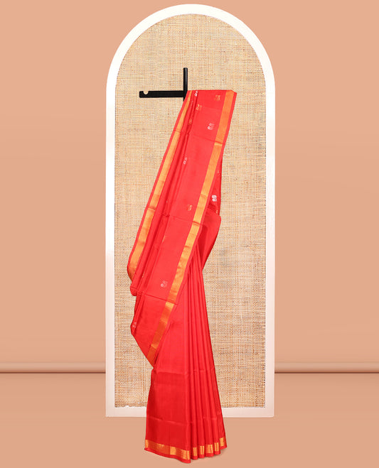 Red Uppada Silk Saree, Spotlighted with Zari Buttas, a Zari Bavanji Border, Floral Buttas Pallu, and a Matching Blouse