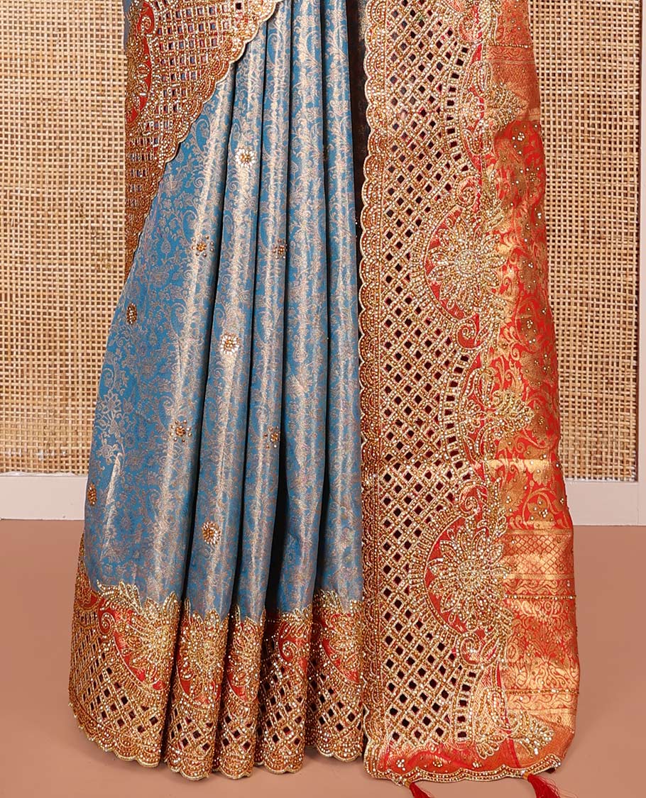 Blue Vastrakala Silk Saree, Adorned with Floral Jacquard and Stone Work, Complemented by Contrast Traditional Zari and Cut Embroidered Scallop Border, Gleaming Grand Zari-Stone Work Pallu, and Paired with Contrast Heavy Stone Embroidered Blouse