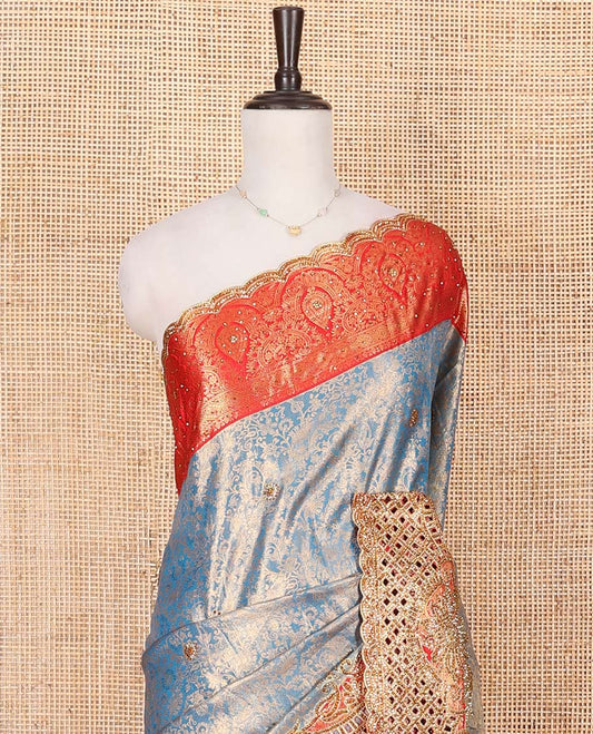 Blue Vastrakala Silk Saree, Adorned with Floral Jacquard and Stone Work, Complemented by Contrast Traditional Zari and Cut Embroidered Scallop Border, Gleaming Grand Zari-Stone Work Pallu, and Paired with Contrast Heavy Stone Embroidered Blouse