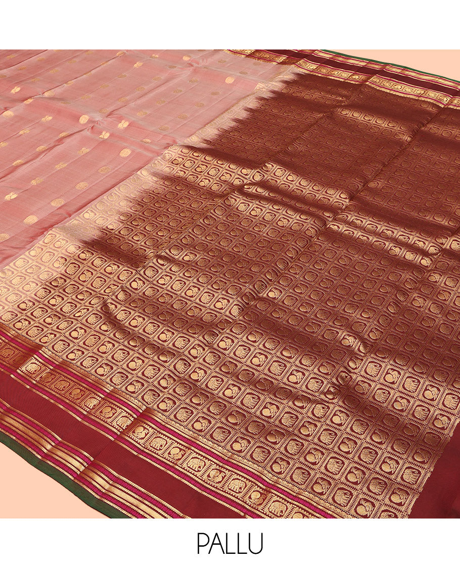 Pink Vasundhara Lite Silk Mix Saree, Decked Up with Mayil-Chakram Buttas, a Contrast Traditional Rettai Pettu Border, Pallu of Mayil-Yaanai Butta Enclosed Checks, and a Contrast Blouse