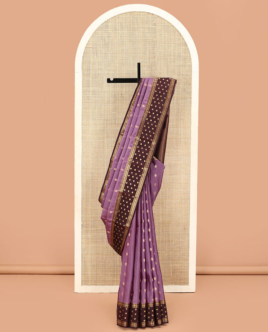Purple Vasundhara Lite Silk Mix Saree, Adorned with Zari Buttas on Its Body, Complemented by a Contrast Border of Rekku, Muthu, Kathir, Rudraksham, and Chakram Designs, Pallu Steeped with Traditional Designs, and Paired with a Contrast Blouse